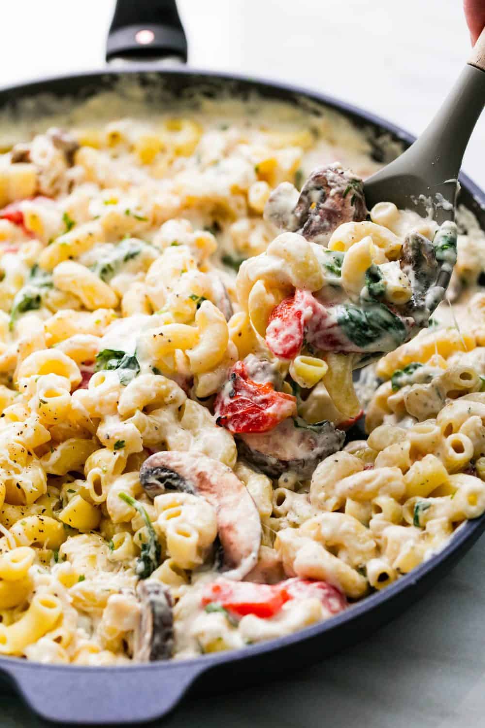 Baked Tuscan Parmesan Macaroni and Cheese in a skillet.