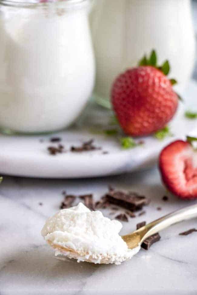 Coconut Mousse scooped in a spoon.