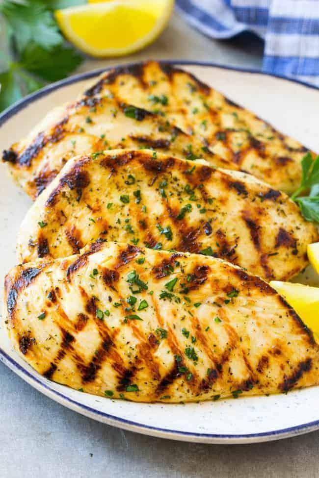 Grilled citrus and herb chicken on a plate.
