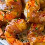 These bacon wrapped shrimp are coated in a sweet and savory glaze and broiled to perfection. The perfect easy appetizer or main course!