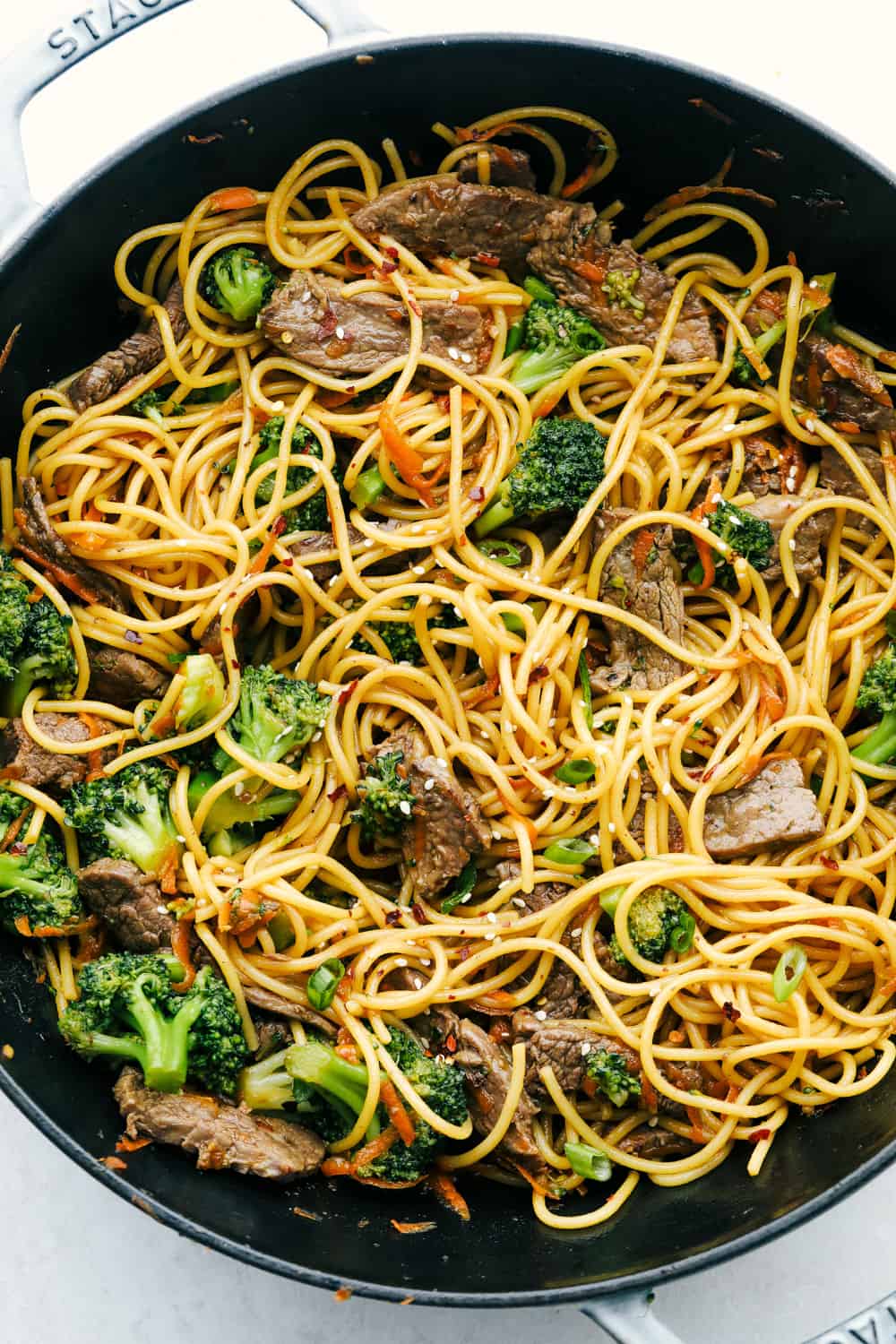 Beef and broccoli lo mein in a skillet. 