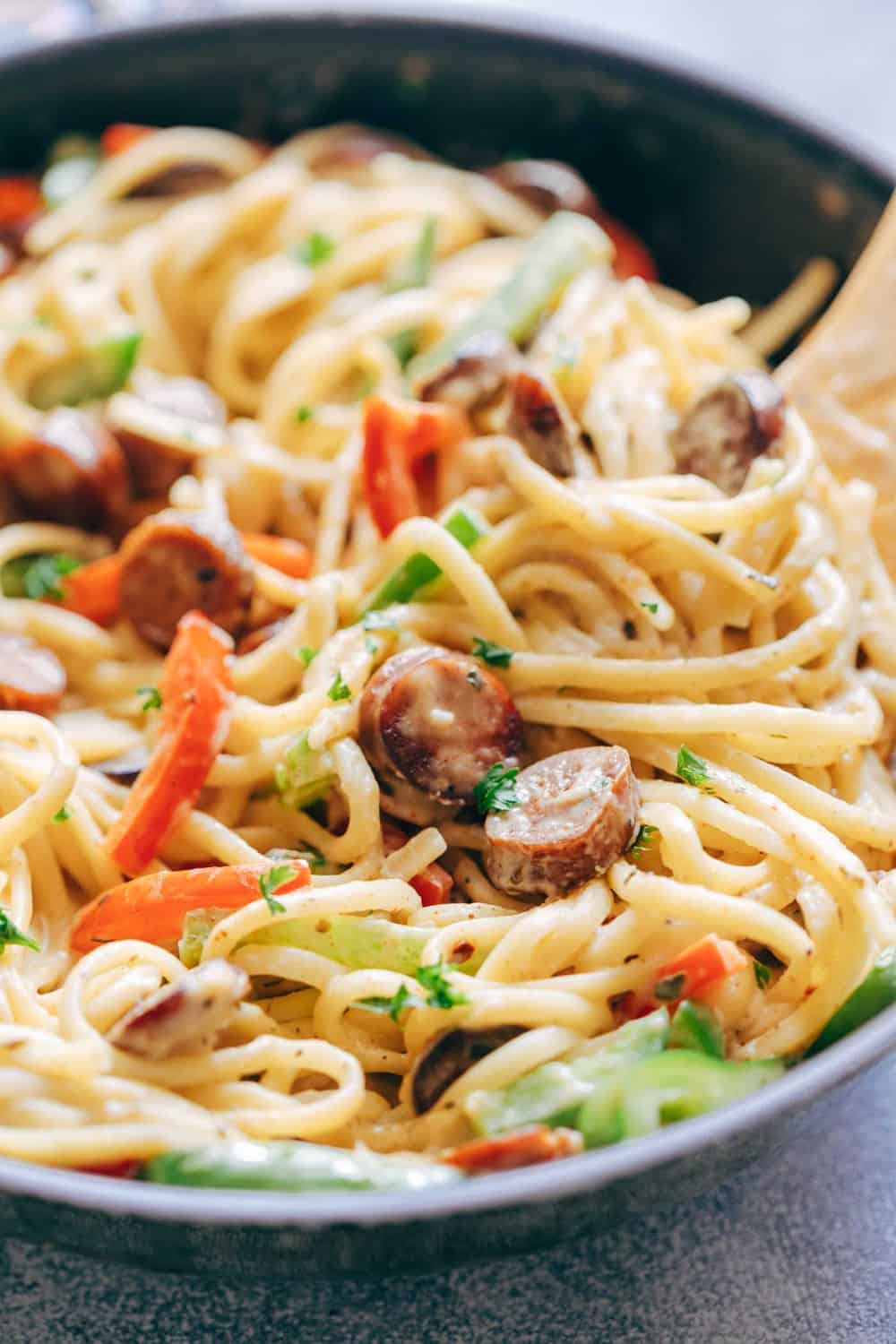 Creamy Cajun Sausage Linguine close up in a skillet.