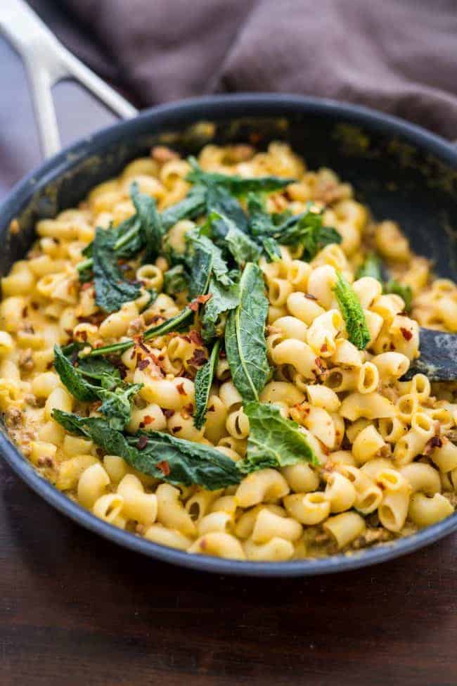 Creamy pumpkin sausage mac and cheese with kale is pure comfort food! It’s a fast, easy dinner recipe when you crave homemade pasta in a bowl.