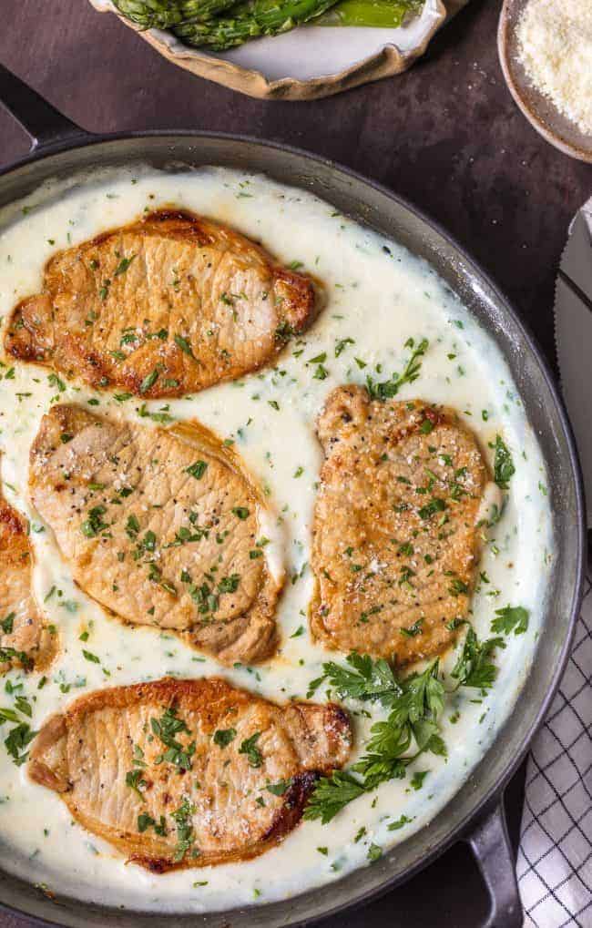 These Creamy Parmesan Pork Chops in a skillet.