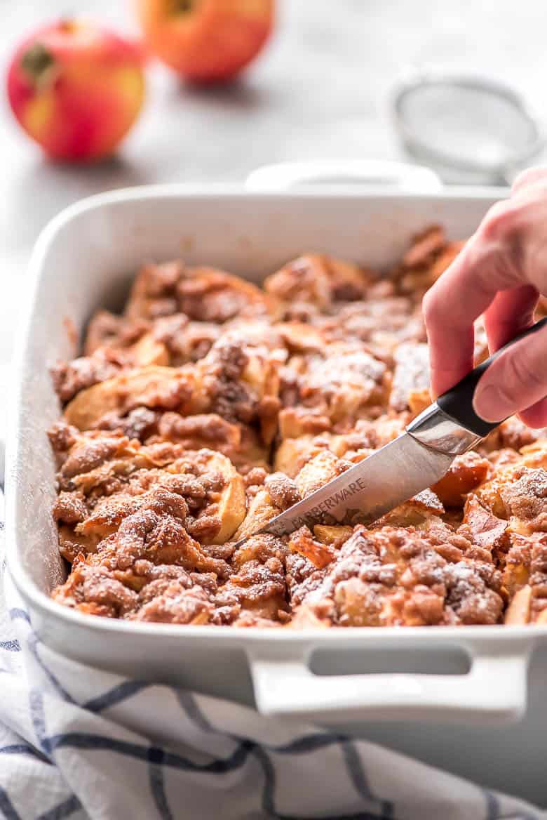 Overnight Cinnamon Apple French Toast Casserole in a white baking dish.