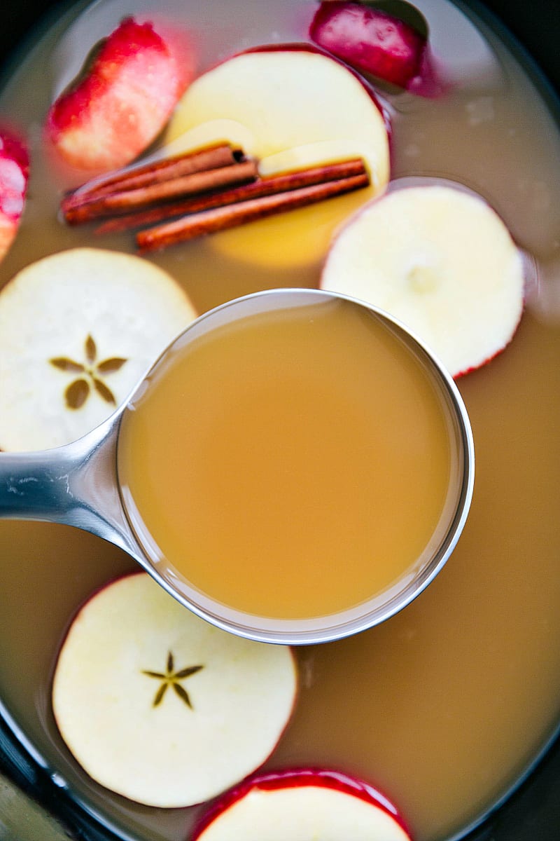 Homemade apple cider in a ladle.