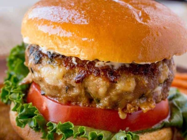 Spinach Feta Turkey Burgers with fresh spinach, salty crumbled feta cheese and a super tender turkey patty topped with lemony greek yogurt.