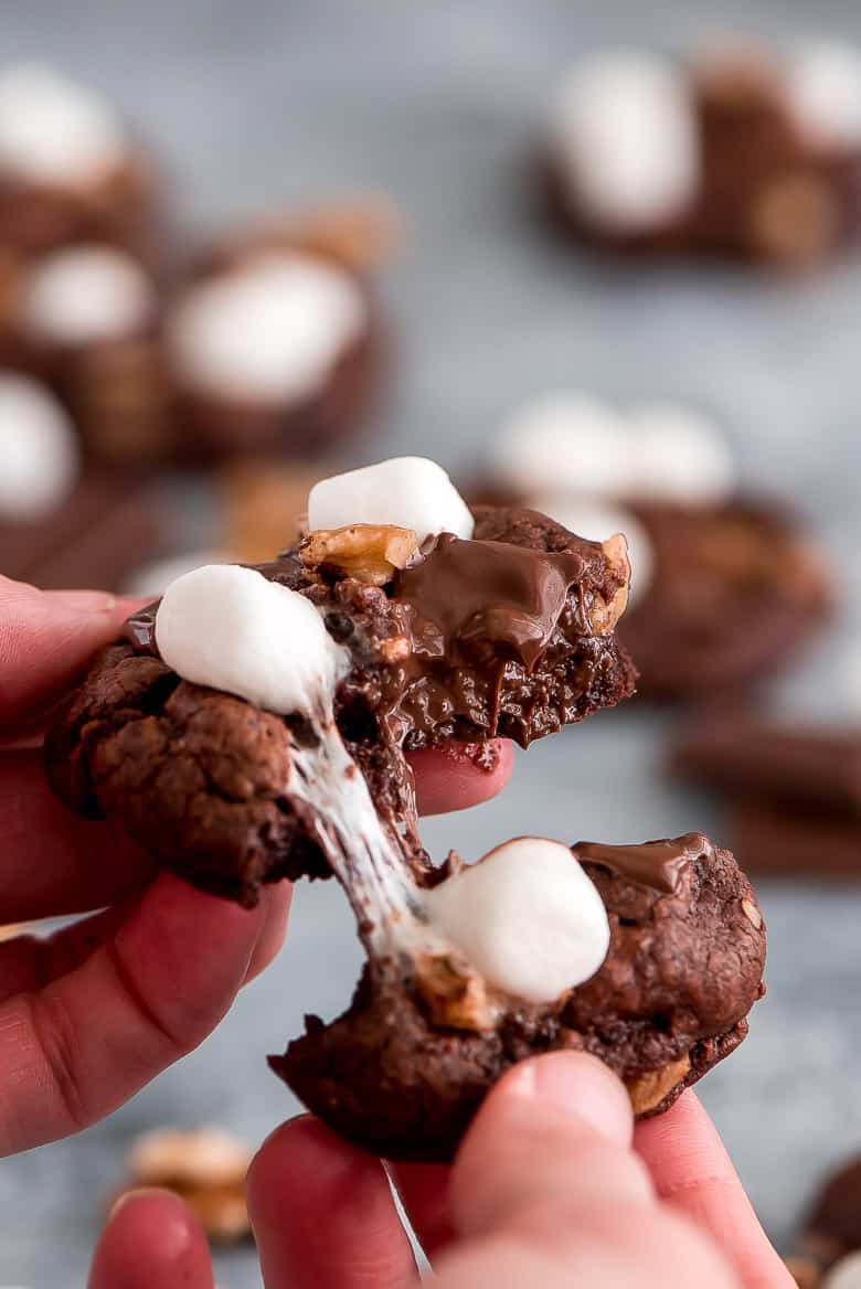 These rich Rocky Road Chocolate Cookies being pulled apart to show gooey insides.