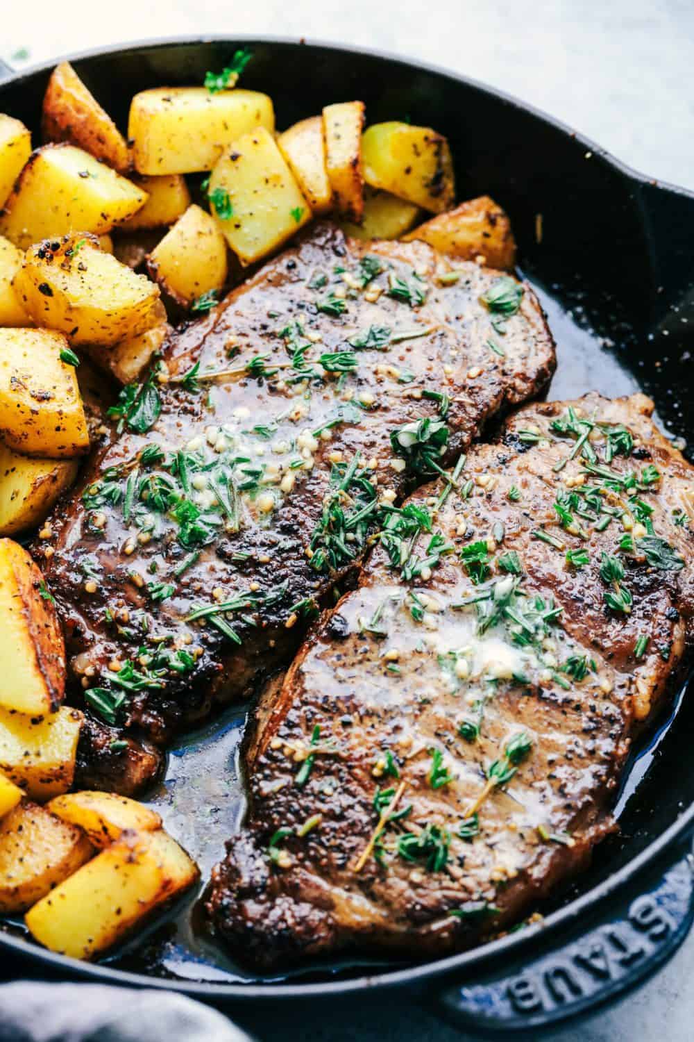 Skillet Garlic Butter Herb Steak and Potatoes in a skillet.