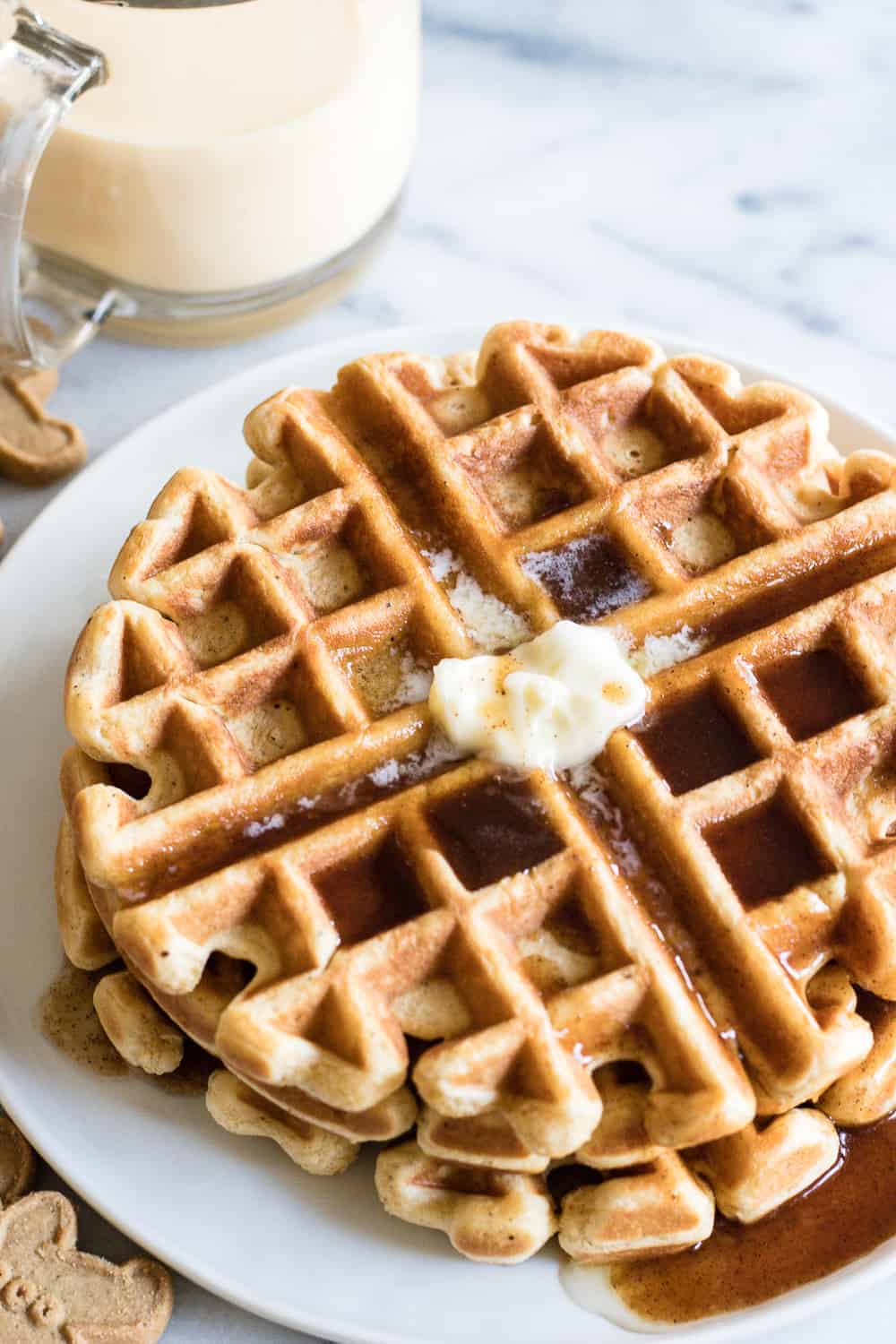 2 Light and fluffy waffles on a white plate.