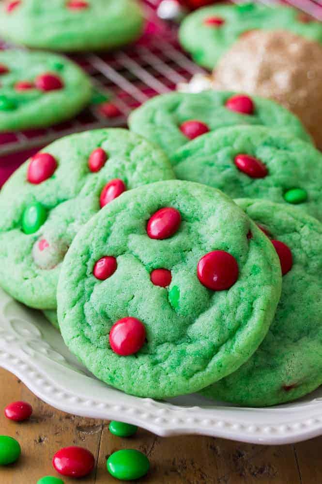 Grinch Cookies stacked on a plate.
