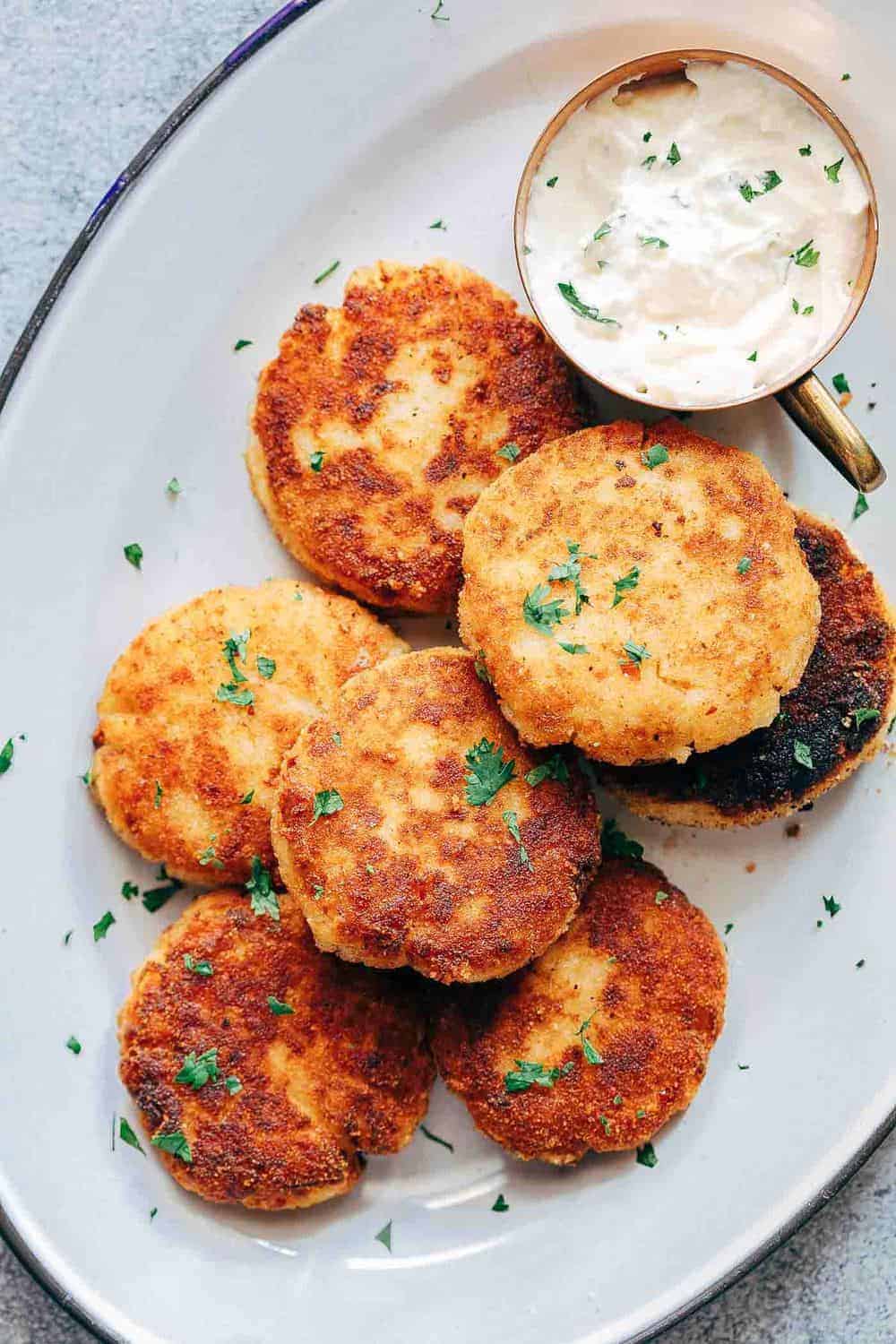 These ham mashed potato cakes are the most amazing way to use leftover mashed potatoes. They are incredibly cheesy and make for a delicious snack or appetizer!