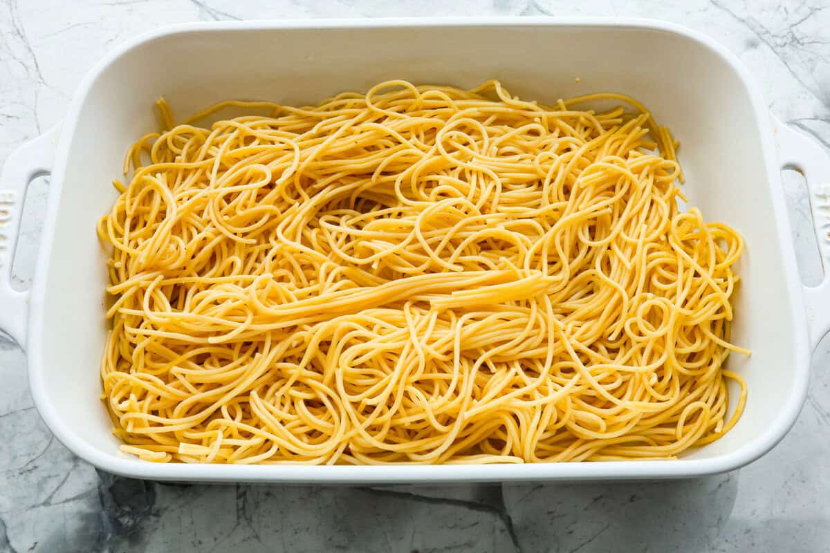 This chicken tetrazzini casserole is packed with delicious flavors and textures. It has hearty chicken, tender mushrooms, peas, and pasta, all tossed in a creamy, rich sauce. The casserole is topped with crispy, buttery breadcrumbs and a sprinkle of Parmesan cheese with the most irresistible crunch and flavor. Overhead shot of spaghetti