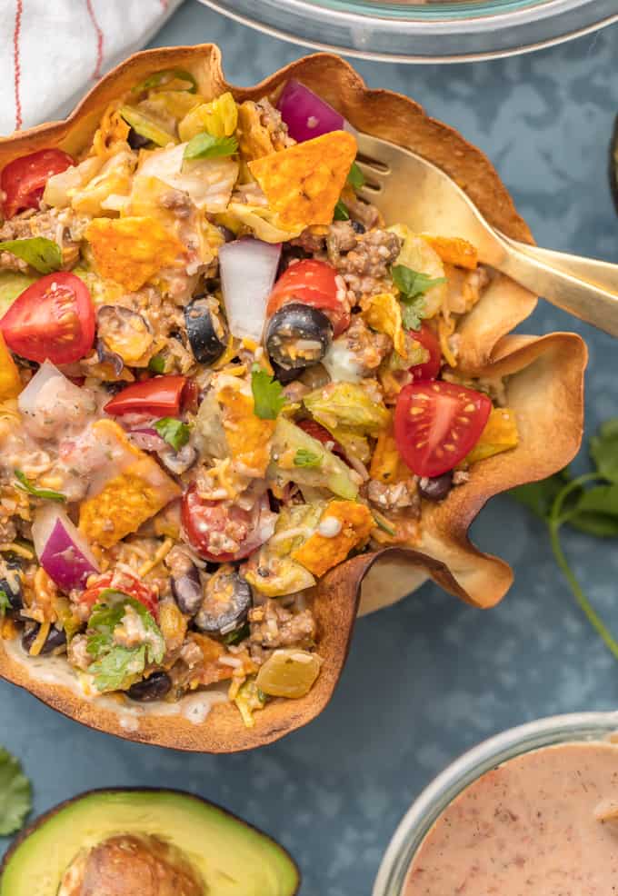Close up of Creamy Taco Salad in a decorative wooded bowl. 