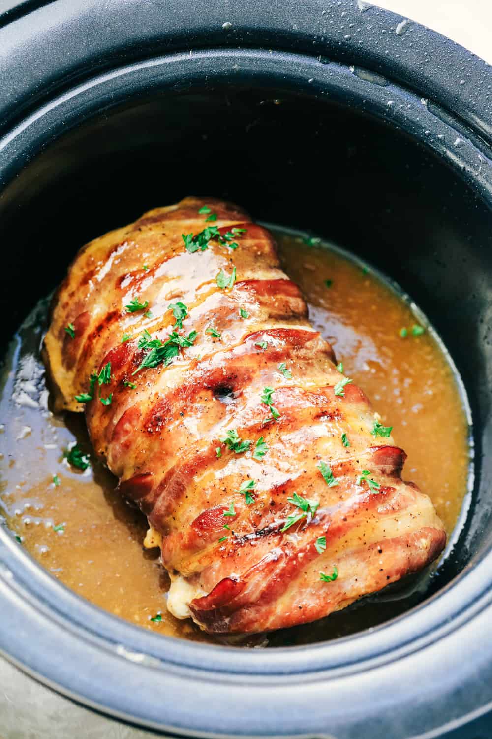 Slow Cooker Bacon Wrapped Maple Glazed Pork | therecipecritic