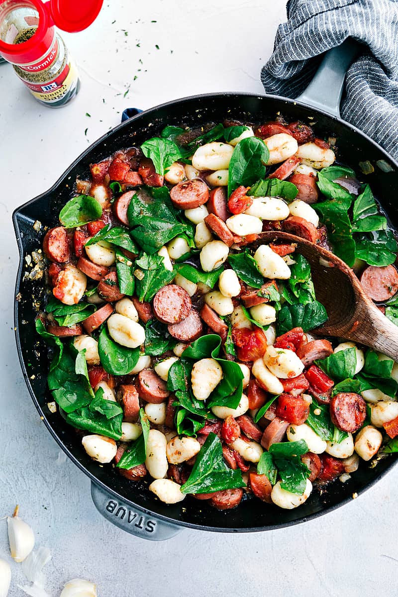 Spinach and Sausage Gnocchi with Sage in a skillet.