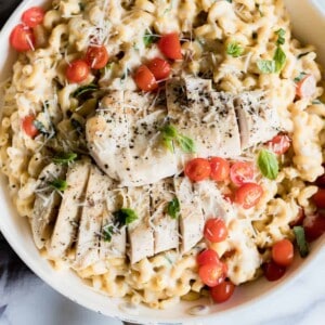 Chicken Caprese Mac and Cheese. A quick and easy one pot meal loaded with juicy chicken, cheesy pasta and fresh tomatoes and basil.