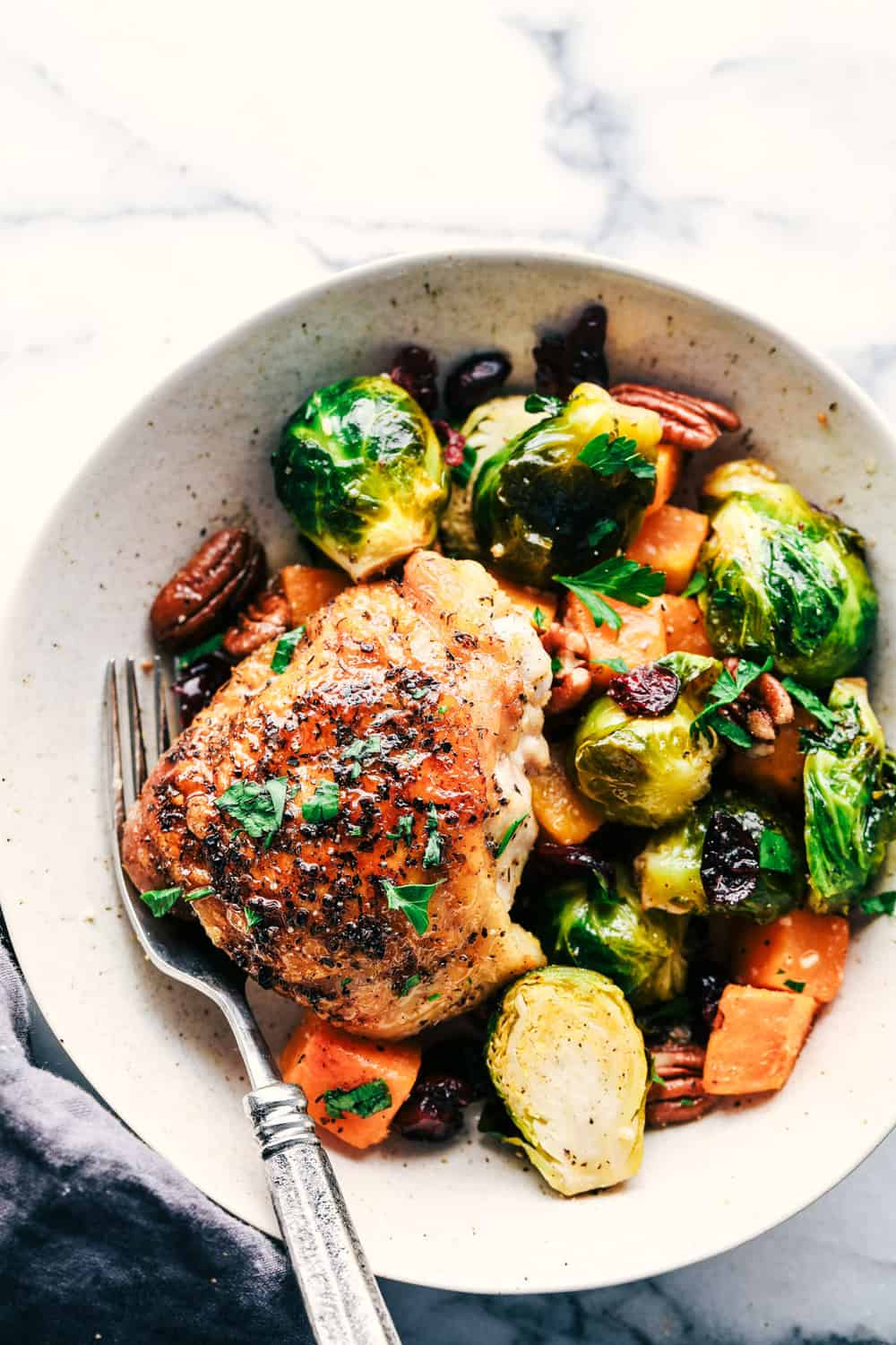 roasted honey garlic butter chicken with Brussels sprouts and butternut squash plated 
