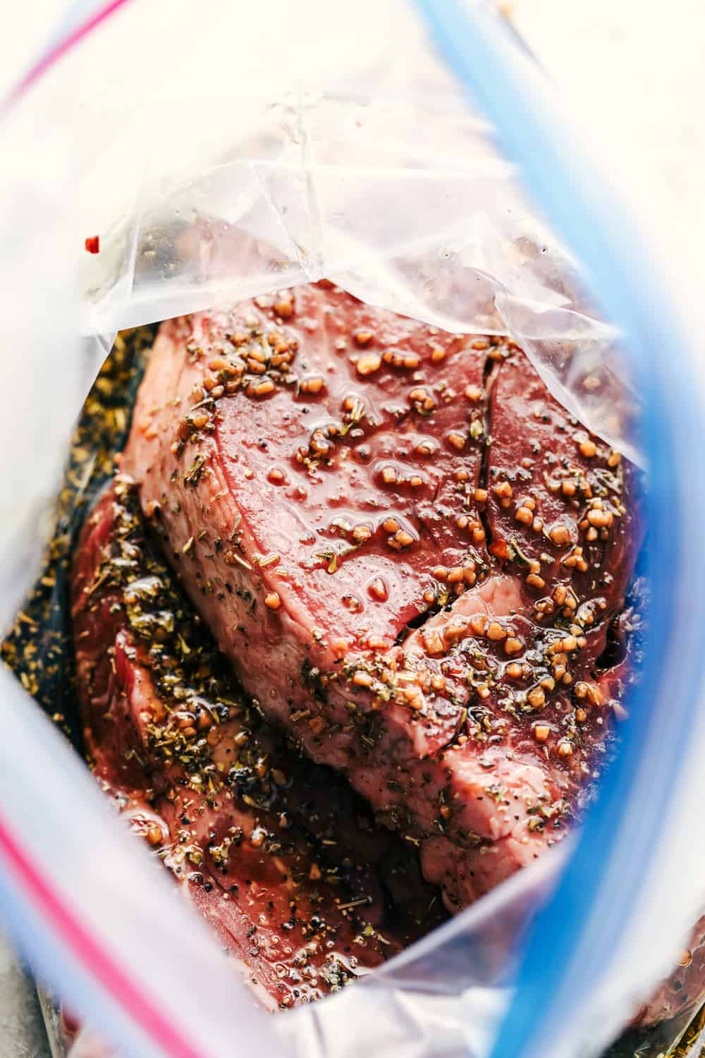 Steak marinating in ziploc bag.