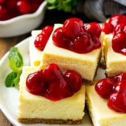 These cherry cheesecake bars are the perfect make-ahead dessert for any occasion! Creamy cheesecake sits atop a homemade graham cracker crust, and is finished off with a generous helping of cherries.