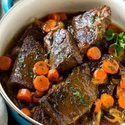 These fork tender root beer glazed short ribs are the perfect meal for a cold winter night. Serve them over mashed potatoes for a dinner that's sure to earn rave reviews from family and friends!