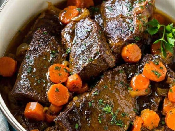 These fork tender root beer glazed short ribs are the perfect meal for a cold winter night. Serve them over mashed potatoes for a dinner that's sure to earn rave reviews from family and friends!