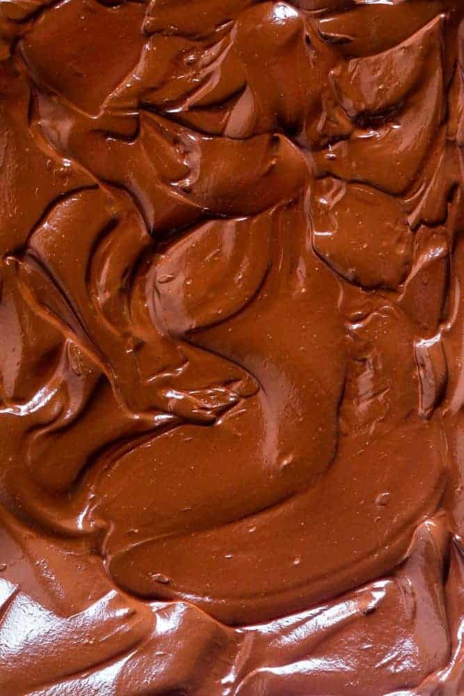 Closeup of chocolate ganache on top of the chocolate chip banana cake