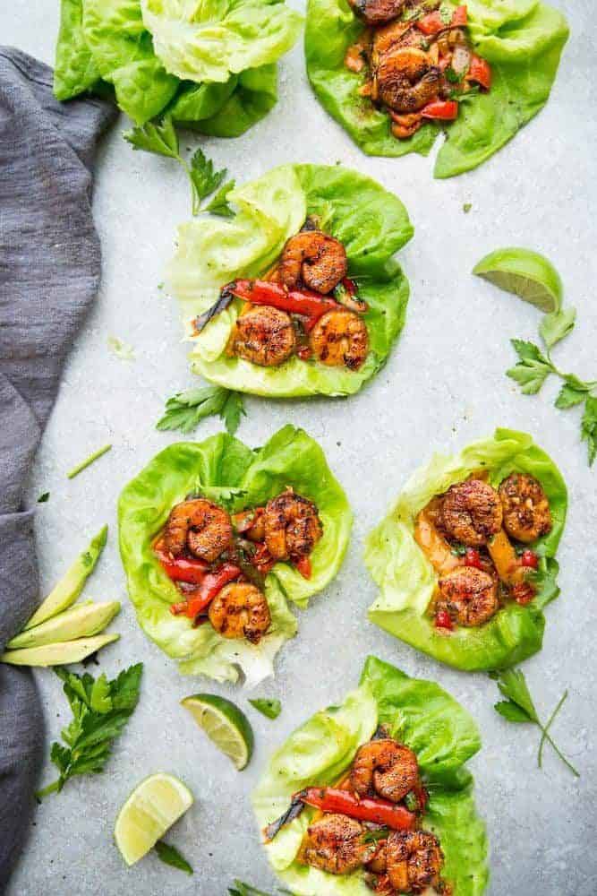 Cilantro Lime Shrimp Lettuce Wraps with sliced lime on the side. 