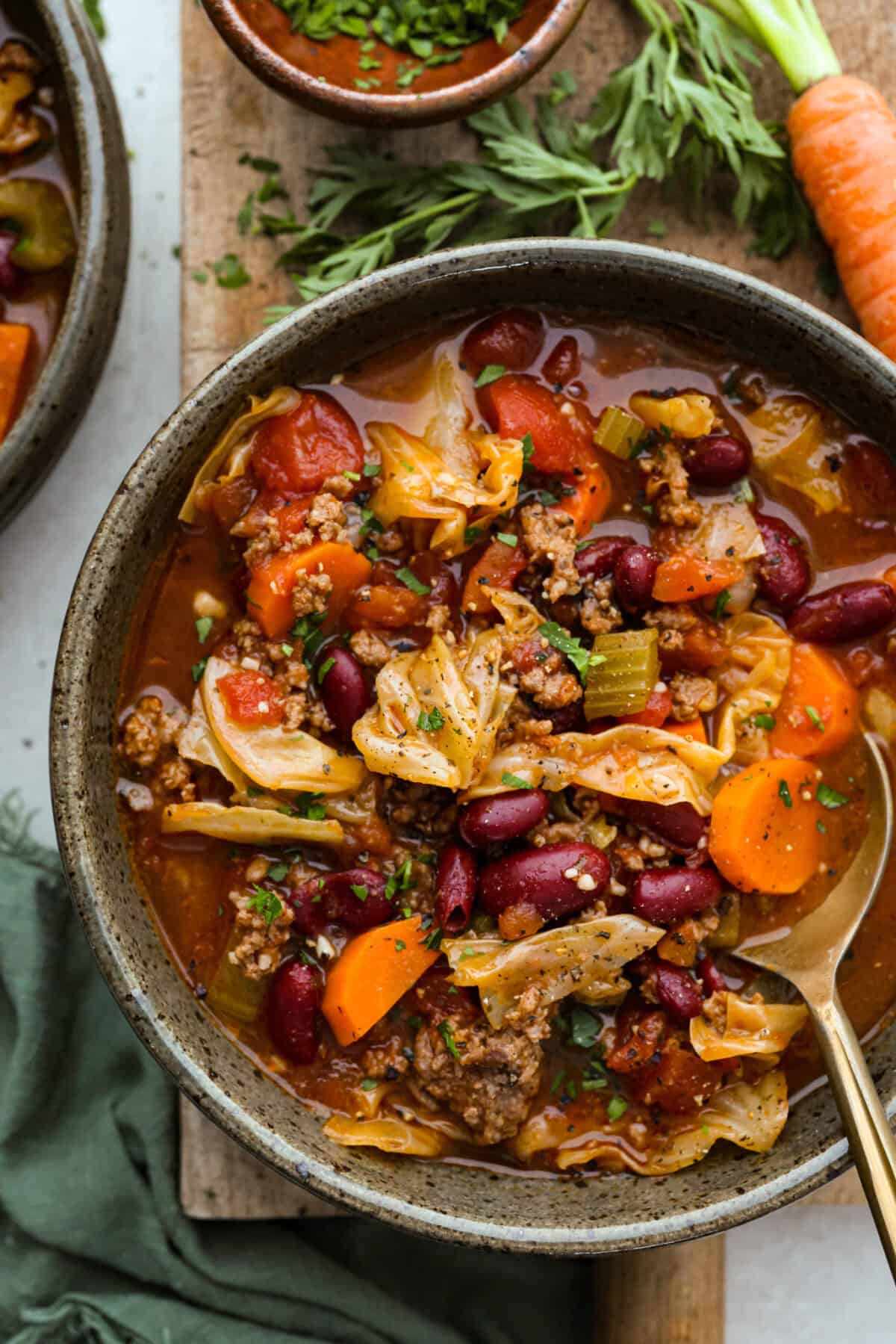 Overhead shot of a bowl of beef and cabbage soup. 