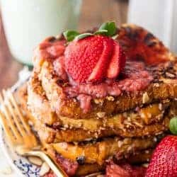 Almond French Toast with Roasted Strawberry Syrup is the ultimate easy dairy free breakfast recipe! Our entire family loves this crunch french toast.