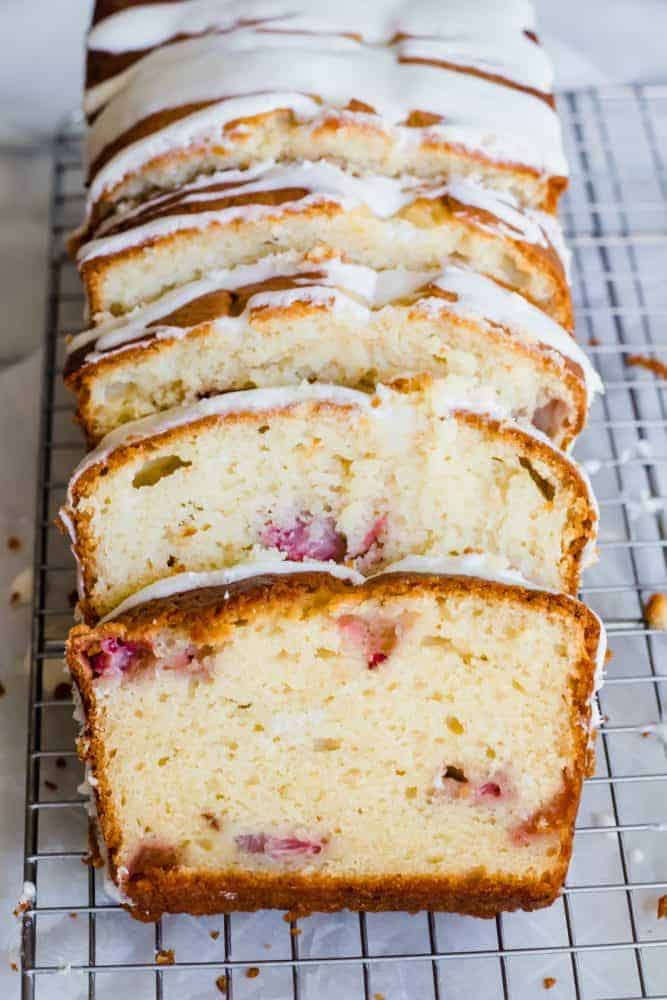 Strawberry Pound Cake sliced and on a cooling rack. 