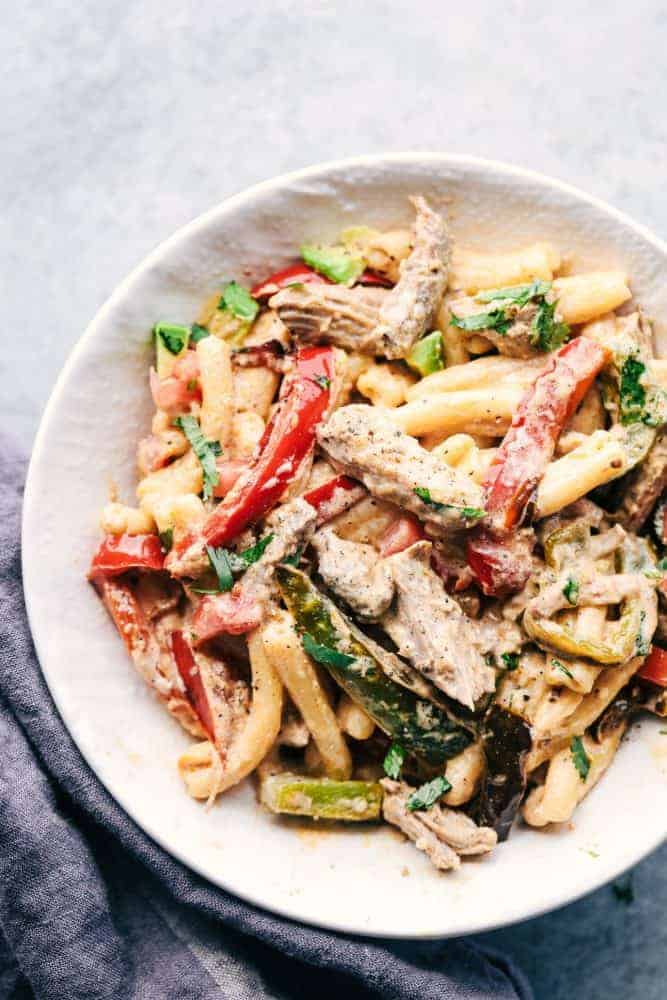 Creamy Pork Carnitas Pasta in a white bowl. 