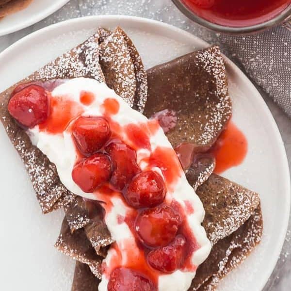 chocolate crepes with strawberries and whipped cream