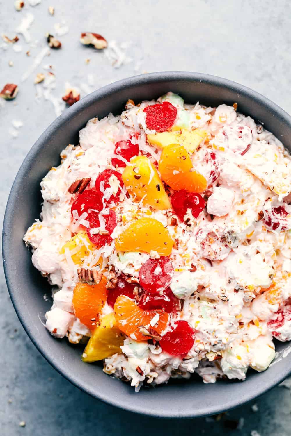 Ambrosia Salad on a black plate.