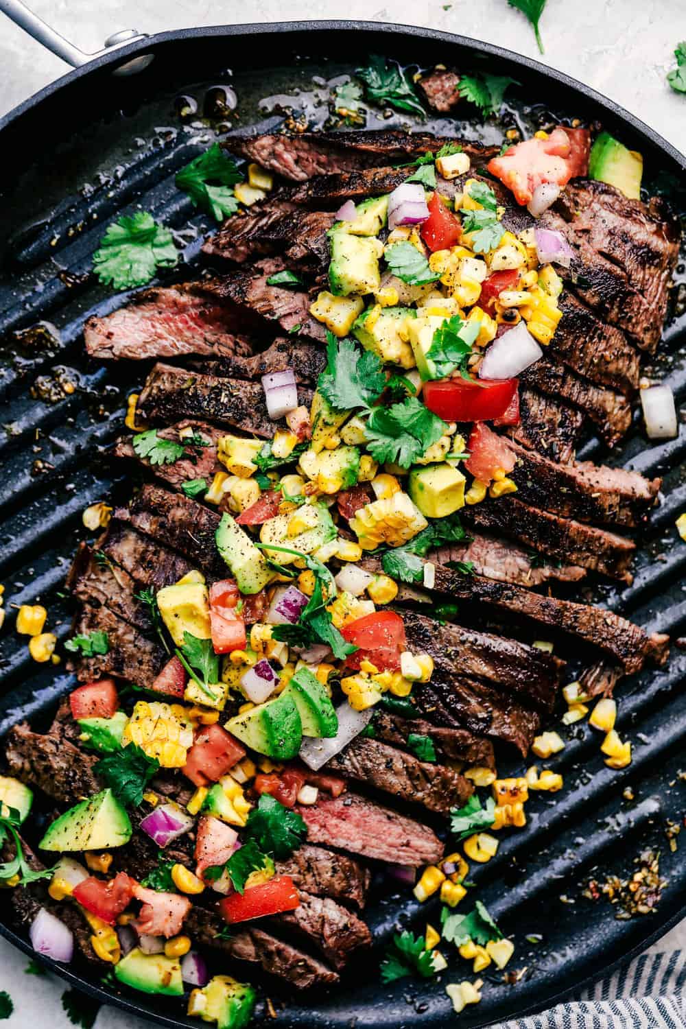 Grilled Garlic Herb Flank Steak with Avocado Corn Salsa | The Recipe Critic