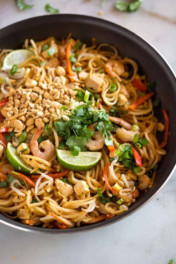 Homemade pad thai, in a skillet, ready to serve.