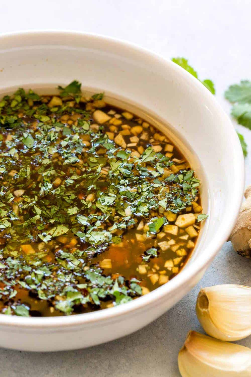 Homemade asian marinade in a white bowl