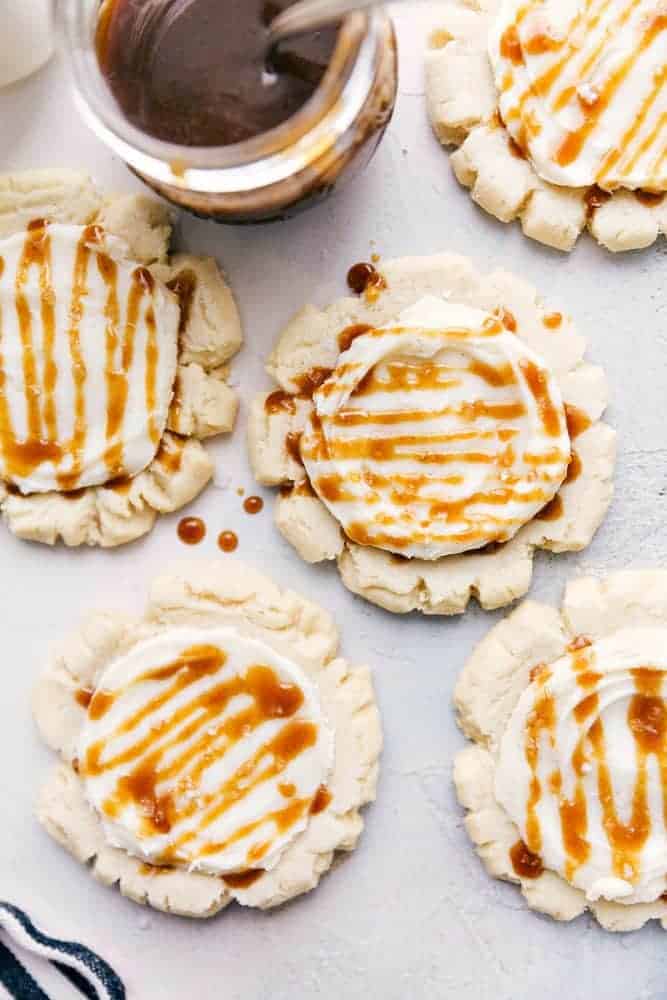 Sugar cookies with cream cheese frosting and salted caramel drizzle. 