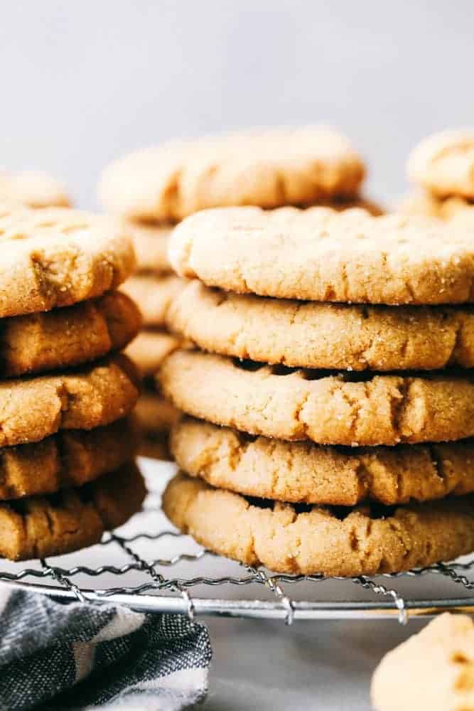 Stacks of soft peanut butter cookies on a cooling cookie rack.