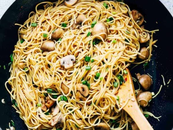 Garlic mushroom noodles tossed up in a wok