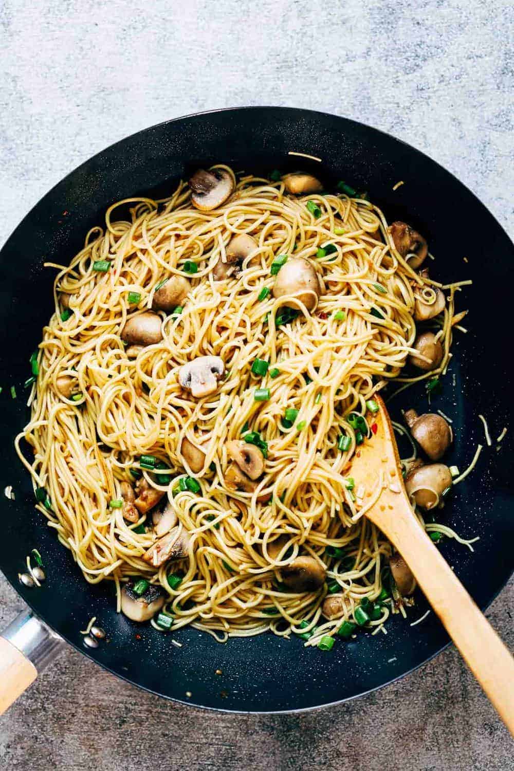 Garlic mushroom noodles tossed up in a wok