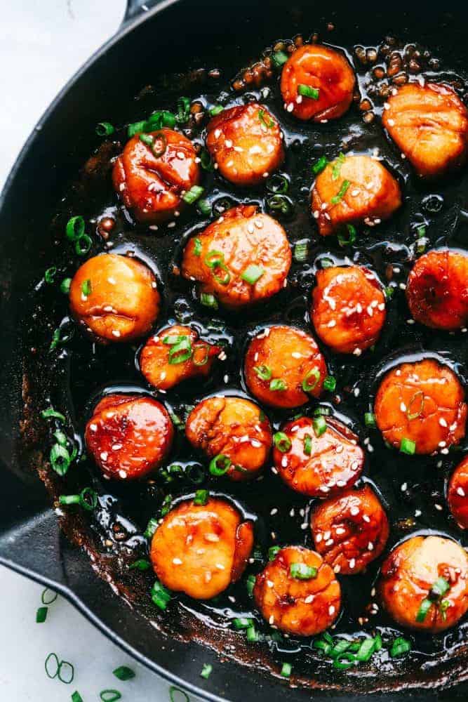 Honey Garlic Butter Scallops in a skillet. 