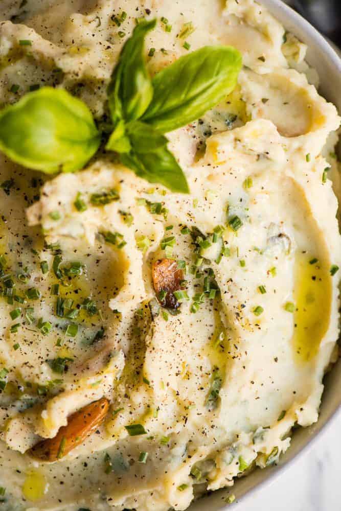 A close up photo of garlic herb mashed potatoes.