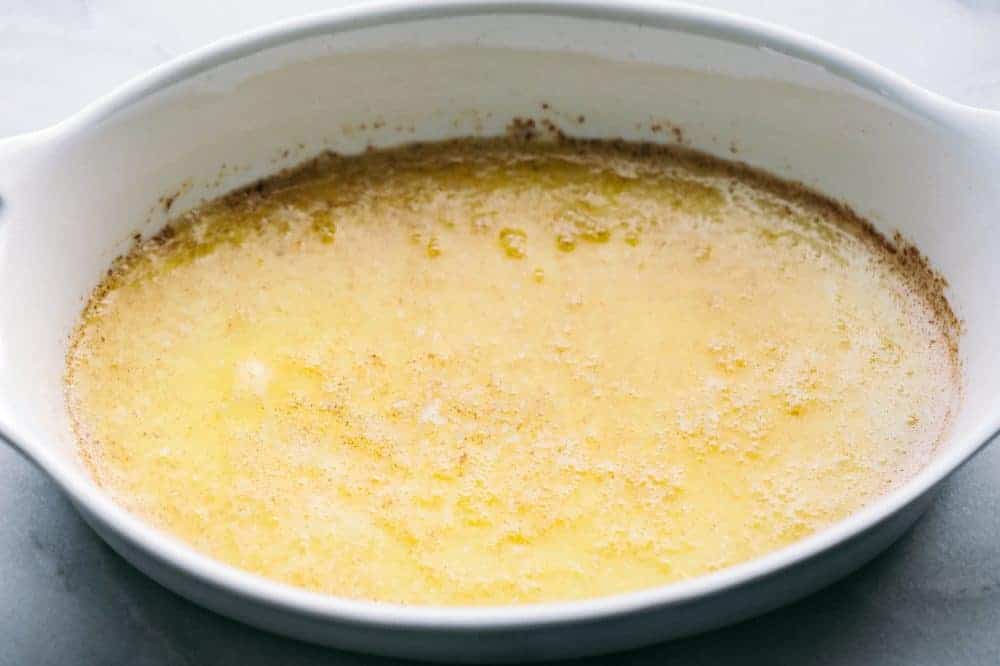 Melted butter in a white dish. 