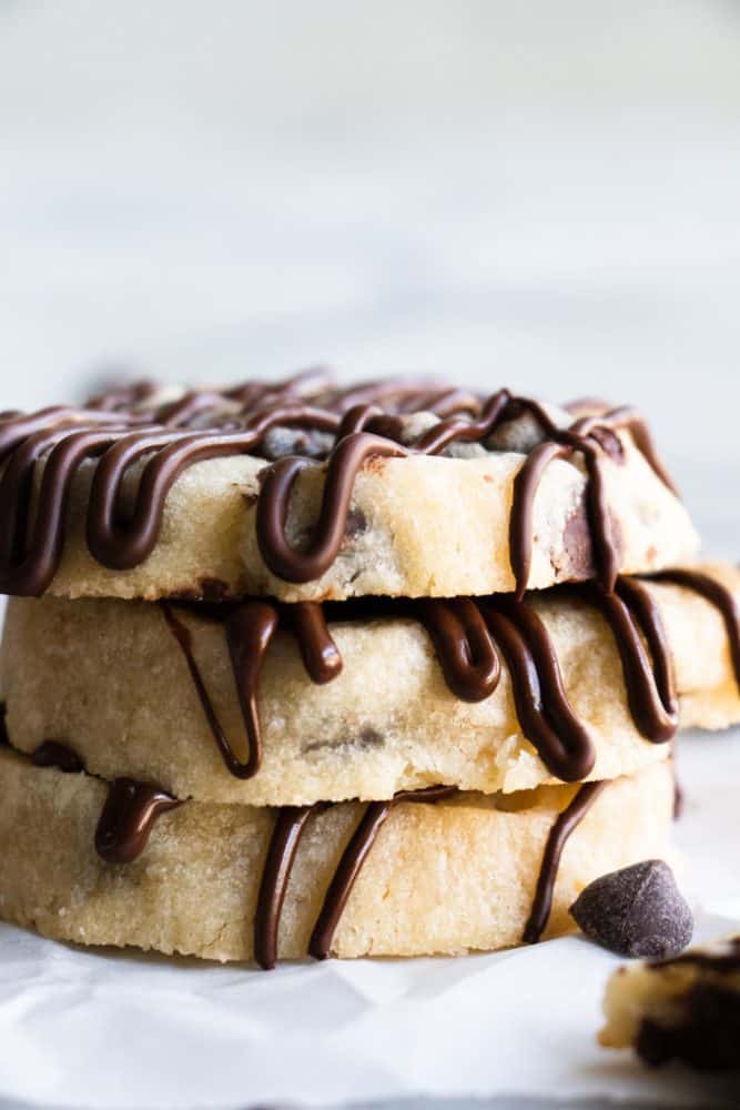 Chocolate chip shortbread cookies stacked on top of one another.