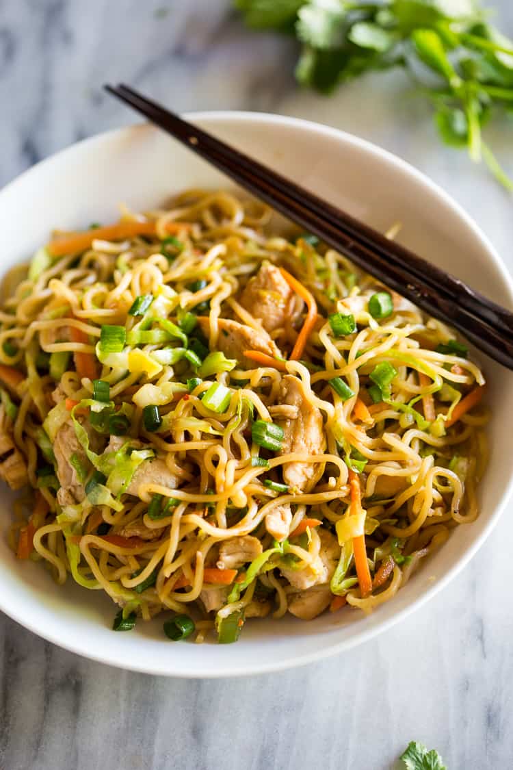 Chicken Chow Mein in a white bowl with chopsticks.