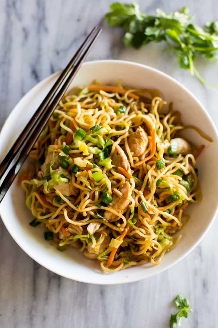 Chicken Chow Mein in a white bowl with chopsticks.