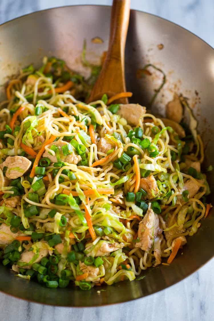 Chicken Chow Mein being mixed together.