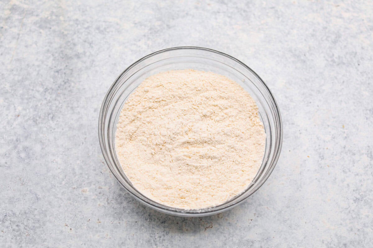 Overhead shot of dry ingredients mixed in a glass bowl. 