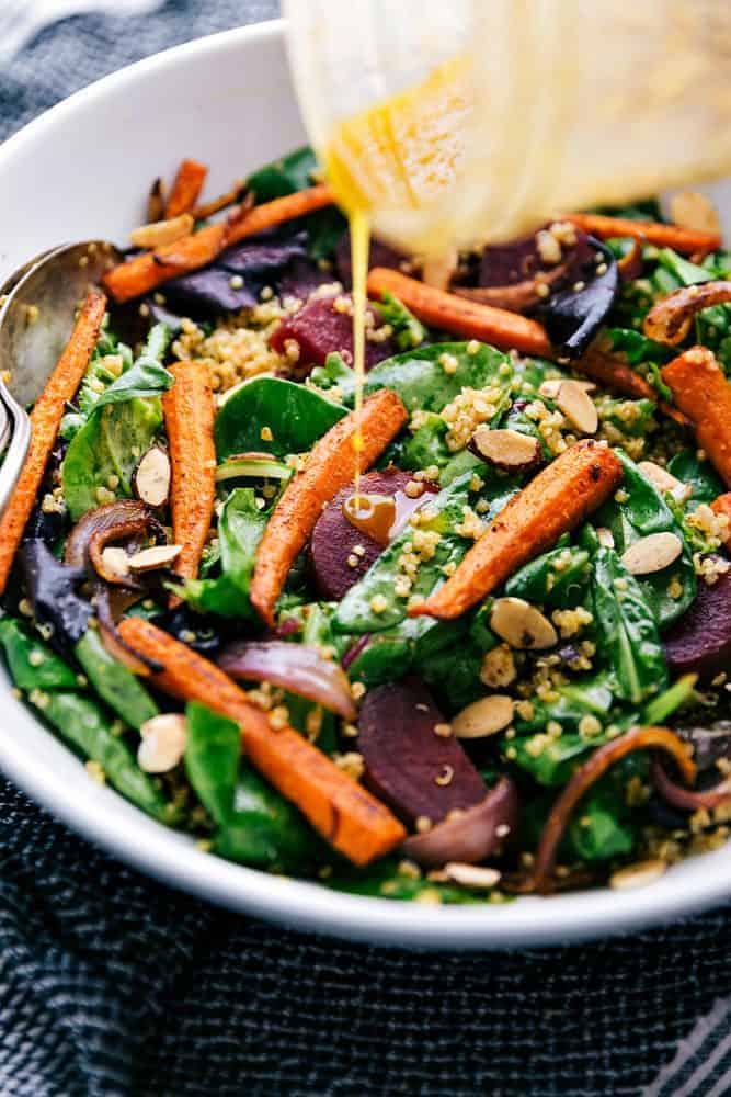 This roasted beet, quinoa, and carrot salad is packed with healthy and good-for-you ingredients! It's super flavorful and has the best lemon dressing!